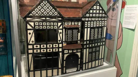 BBC / Elizabeth Baines A dolls house in tudor style decor on display at Abbey House Museum