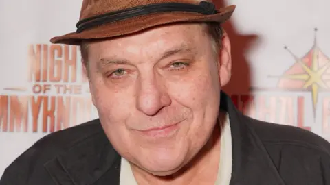 Getty Images Tom Sizemore attends the world premiere red carpet for "Night of the Tommyknockers" at the Fine Arts Theatre on November 19, 2022 in Beverly Hills, California.