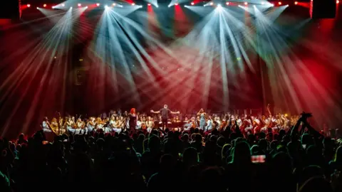 Cross Border Orchestra of Ireland The peace proms involves 6,000 children from schools all over the island, from diverse backgrounds and abilities