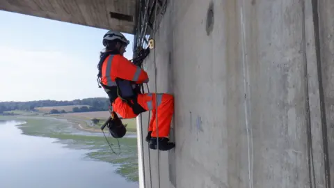 Up and Under Up and Under worker abseiling the Orwell Bridge