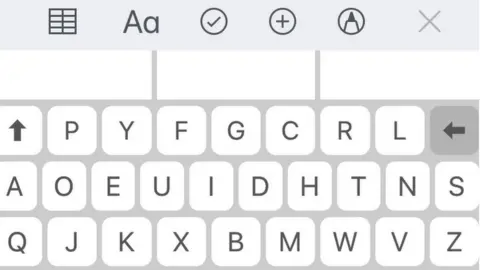 An iPhone with the Dvorak keyboard installed