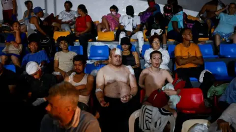 Reuters People rest as they receive treatment in a field hospital in the aftermath of earthquakes, in La Guaira, Venezuela
