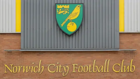 Norwich City Football Club The crest and Norwich City Football Club lettering that are available for bidding