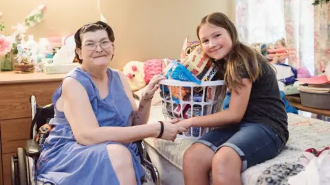 Beth Ann Crenshaw Ruby Kate with a resident