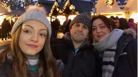 Family photo Emiah and her parents Simon Ellis and Menna Garland-Ellis