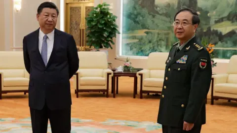 AFP China's President Xi Jinping and General Fang Fenghui, chief of the general staff of the Chinese People's Liberation Army in 2017