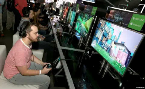 Microsoft A man playing on a console