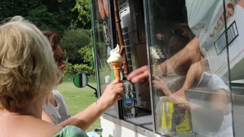 Max Ramsay Woman being served at an ice cream van