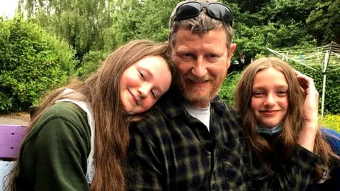 Family Handout Howard Holden with his daughters