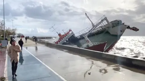 Ship being blown around in the sea.