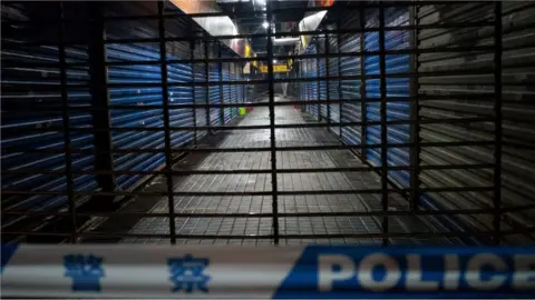 AFP Picture shows the shutters of the closed Huanan Seafood Wholesale Market in the city of Wuhan