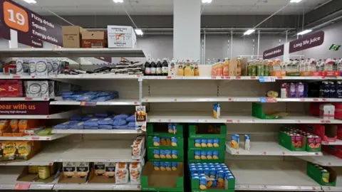 AFP Empty shelves seen at a Sainsbury's in London in September, which has been blamed on the lorry driver shortage