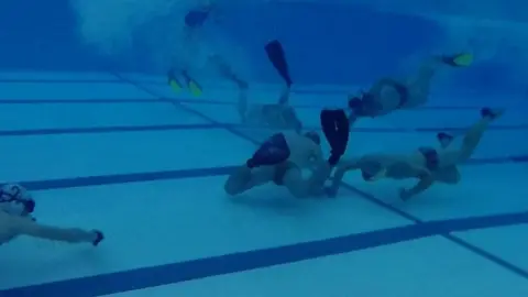 BBC Underwater hockey players in the pool