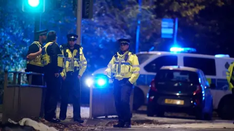 Danny Lawson/PA Wire Police at scene in Horsforth