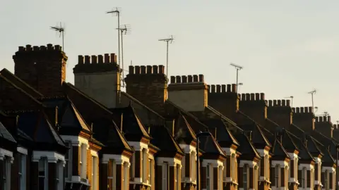 PA Media A row of terraced houses in London