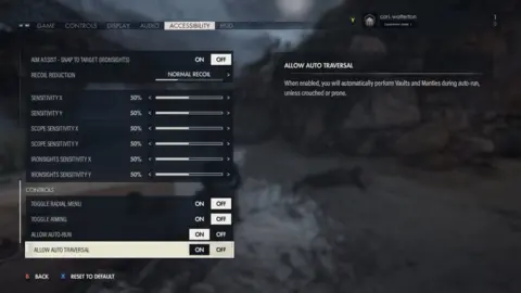 Rebellion Developments An accessibility menu from Sniper Elite 5. Options are listed in a column on the left-hand side of the screen. In the "Controls" sub-menu "Allow auto-traversal" is highlighted and set to "on". To the right of the screen, a tool tip headed "Allow Auto Traversal" is visible. Underneath the heading, the explanation reads: "When enabled, you will automatically perform vaults and mantles during auto-run, unless crouched or prone." Other options visible on the left include "Allow auto-run", "Toggle aiming", "Toggle Radial Menu", as well as various sensitivity adjustments and aim assist features.