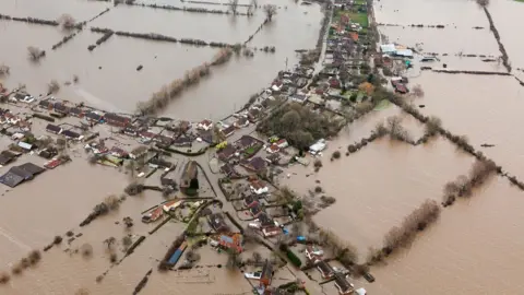 BBC Drone shot of complete village and farmland underwater