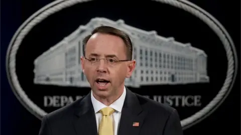 Getty Images US Deputy Attorney General Rod Rosenstein announces the indictment of 13 Russian nationals and three Russian organisations for meddling in the 2016 US presidential election.