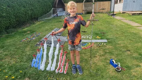 Martin Bridge Martin's son Curtis with Red Arrows model