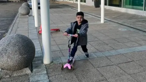 Contributor Sepehr with the scooter that a local family had donated