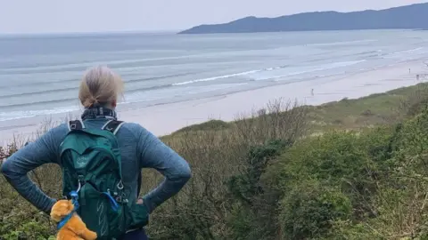 OneWomanAndHisDog Instagram Susan Saker overlooking the sea