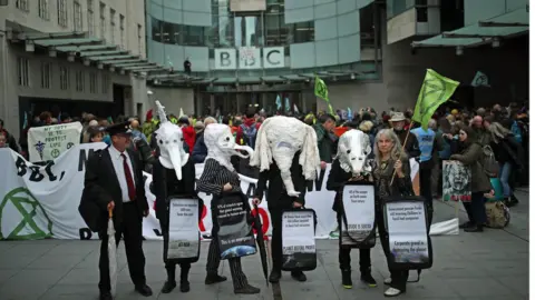 PA Media Protesters outside the entrance to the BBC in London during an Extinction Rebellion protest.