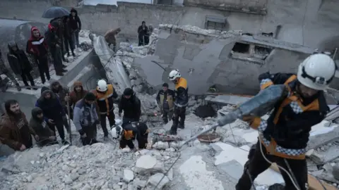 Reuters Rescuers searching for survivors under the rubble