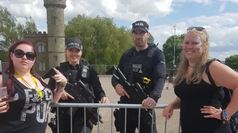 Jade Hodgkins Fans with two armed officers