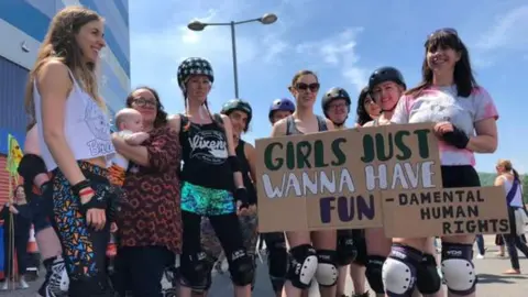 BBC Women and girls take part in the march