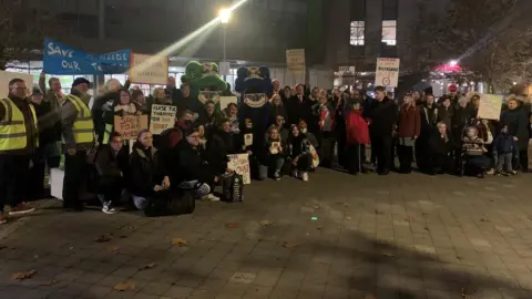 Simon Dedman/BBC A demonstration at the Thameside complex