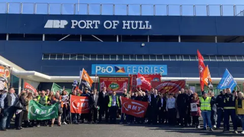 BBC Protesters lined up in front of P&O Ferries office building