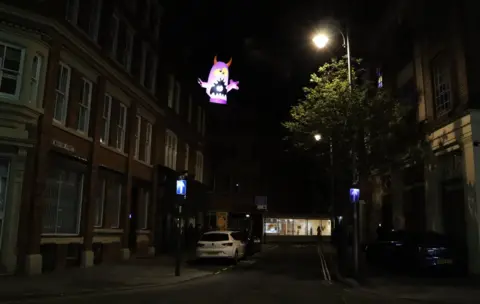 BBC Glowing monster over building