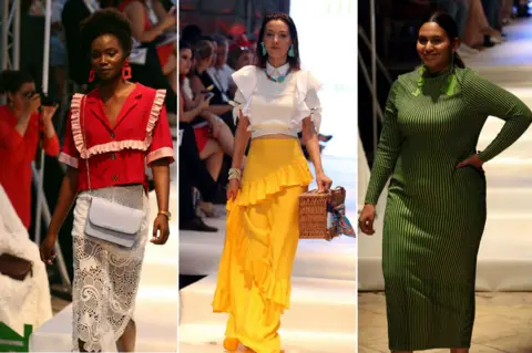 EPA Three models are pictured walking down a catwalk. The first wears a red top and white skirt, the second has a white top and yellow top. The third model wears a green dress.