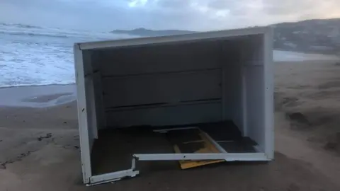 Sady Bartle Hut flipped over, with bare inside visible