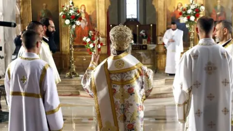 EPA The head of the Bosnian Serb Orthodox Church in Bosnia and Herzegovina conducts an Easter service
