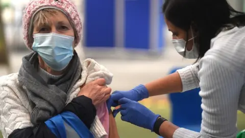 EPA A woman being vaccinated