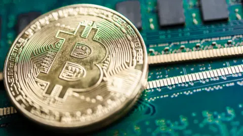 Getty Images A physical representation of a bitcoin on a circuit board