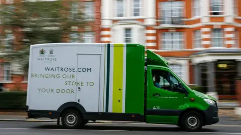 Getty Images A Waitrose delivery truck drives through Maida Vale, London