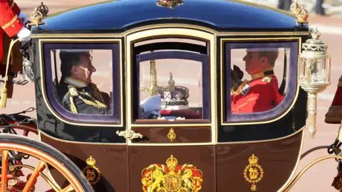 PA Media The crown travels to the state opening