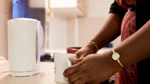 Lisa Bretherick Photography Anonymous woman making a drink