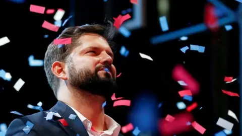 Chile's President-elect Gabriel Boric celebrates with supporters after winning the presidential election in Santiago, Chile