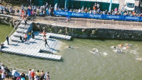 Tough Runner Participants in the water