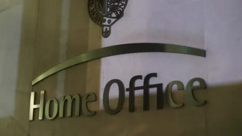 Yiu Mok/PA Home Office signage