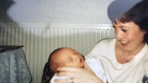 Family photo Conner Marshall as a newborn baby being held by his mother Nadine