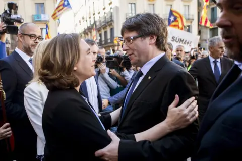 EPA Barcelona Mayoress Ada Colau (L) embraces Catalonian regional President Carles Puigdemont (R) in Barcelona, 16 September