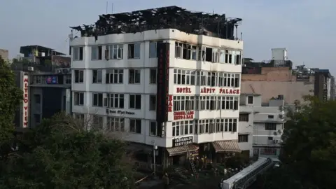 Getty Images The Hotel Arpit Palace after a fire broke out on its premises in New Delhi on February 12, 2019.