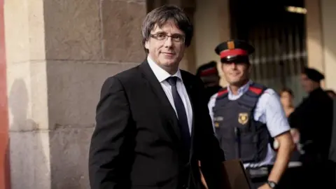 AFP Catalan regional government president Carles Puigdemont arrives to address the Catalan regional parliament in Barcelona on October 10, 2017.