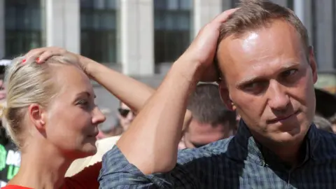 EPA File pic from July 2018: Russian liberal opposition leader and a head of an anti-corruption foundation, Alexei Navalny and his wife Yulia in Moscow