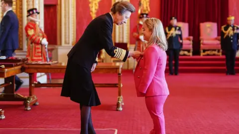 Aaron Chown/PA Wire Maisie Summers-Newton from Wellingborough is made an MBE