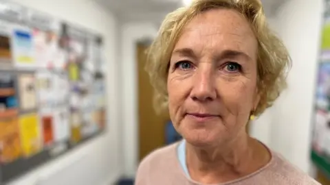 Claire Garrett, CEO at the Harbour Project looking into the camera